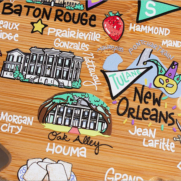 UV-printed bamboo cutting board art featuring an illustrated map of Louisiana highlighting Baton Rouge and New Orleans, showcasing landmarks like Oak Alley Plantation and a Tulane pennant alongside a vibrant red strawberry and a festive yellow Mardi Gras mask