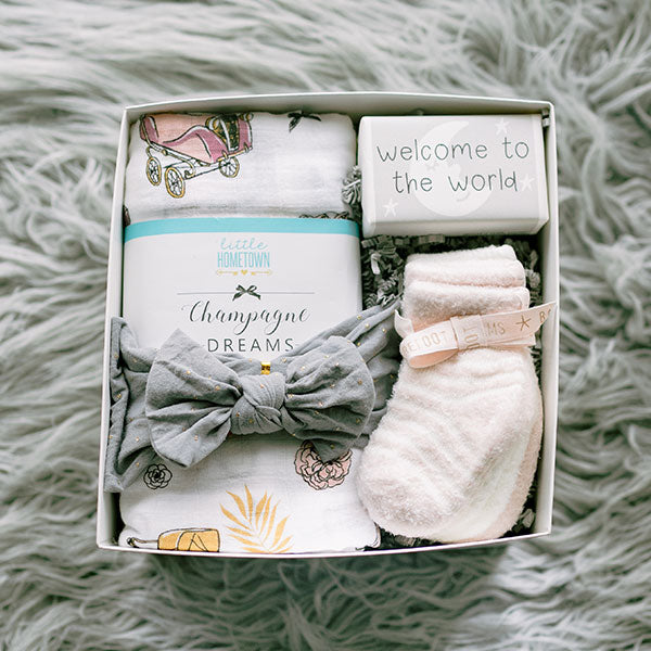 Barefoot Dreams baby sock set, bow headband, Champagne Dreams muslin swaddle, baby-safe bar soap, baby shower gift for girl
