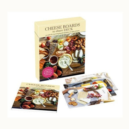Product photography of the Cheese Boards to share DECK by Thalassa Skinner featuring a boxed gift set, instructional booklet, and recipe cards displaying colorful arrangements of vibrant red grapes, creamy cheeses, and rustic wooden platters on a white background