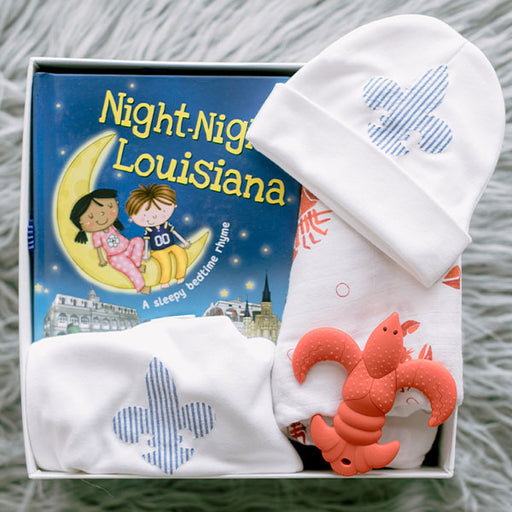 Louisiana-themed baby clothes, book, and teether