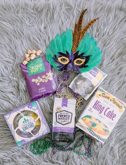 King Cake flavored snacks and coffee with Mardi Gras beads and feather mask Louisiana gift box