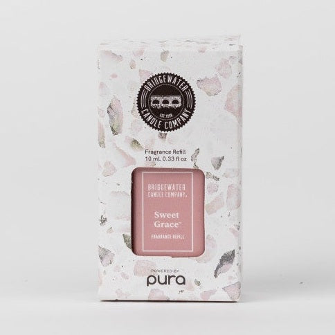 Product photograph of a Bridgewater Candle Company Sweet Grace fragrance refill box centered on a plain white background featuring pink and grey terrazzo-patterned packaging with a black circular bridge emblem and Pura branding