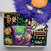 Mardi Gras snacks with feather mask gift box