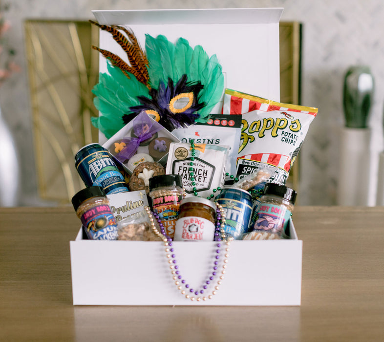 Feather mask, Mardi Gras beads, New Orleans seasoning blends and snacks, Mardi Gras party box